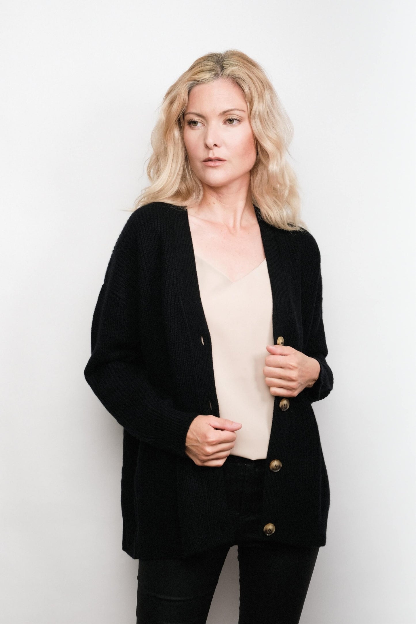 Model wearing black cashmere cardigan over cream camisole – Love Cashmere NZ