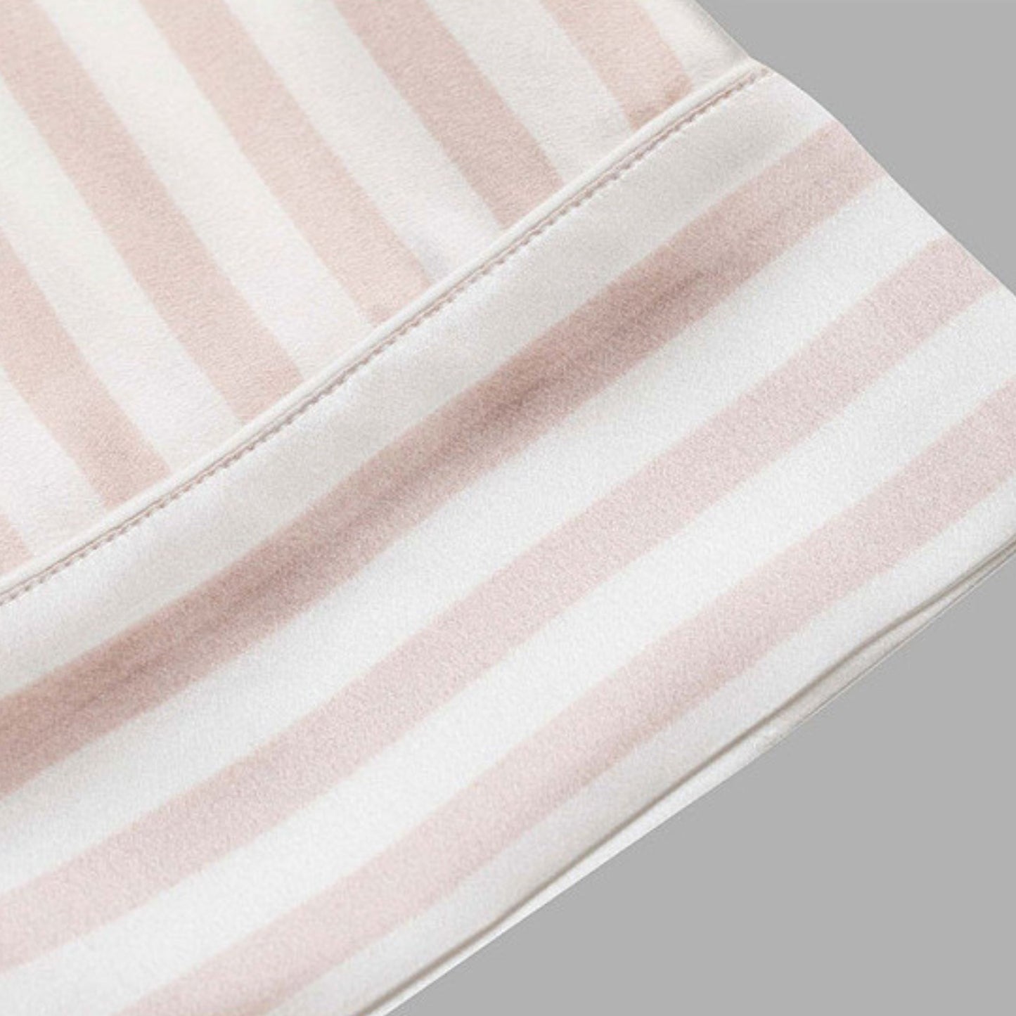Close-up of pink and white striped silk fabric hem – LS Silk NZ
