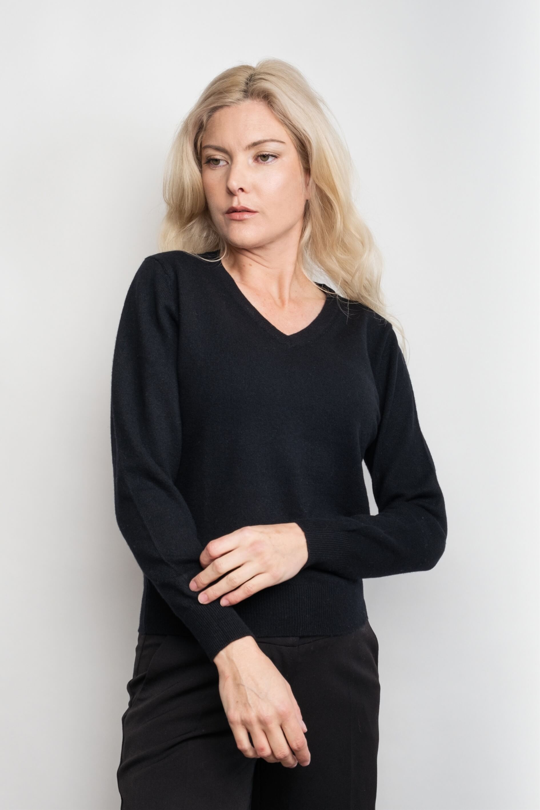 Woman wearing black ribbed V-neck cashmere sweater – Love Cashmere NZ
