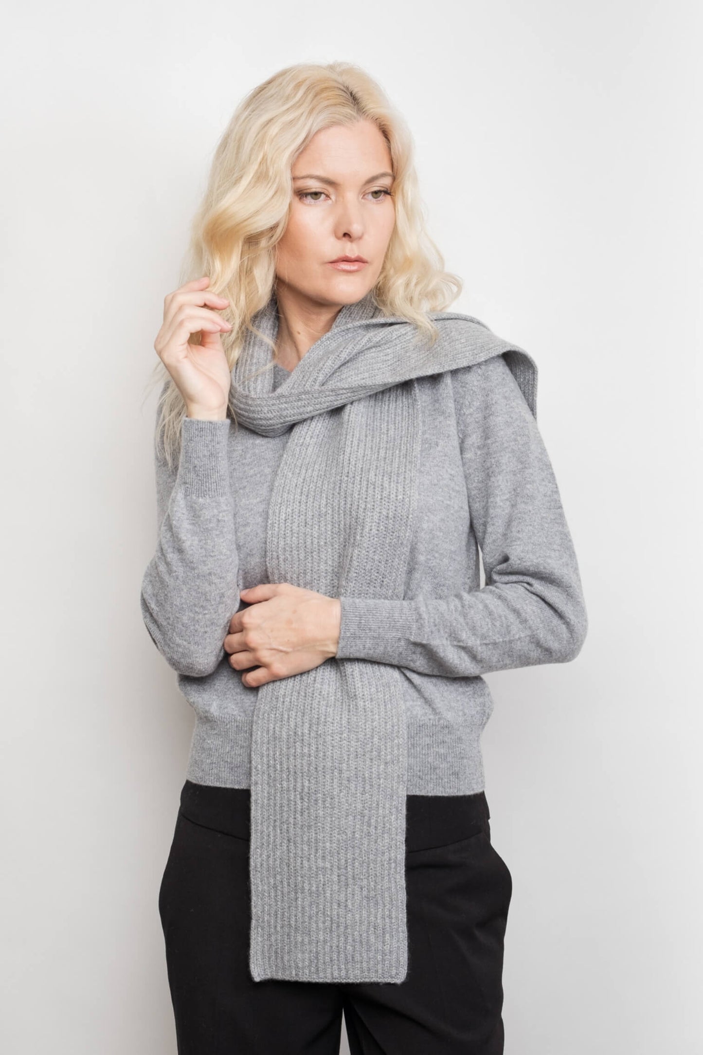 Model wearing slim ribbed grey cashmere scarf over grey sweater – Love Cashmere NZ