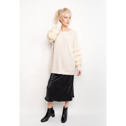 Woman styling black silk midi skirt with cream sweater and boots – LS Silk NZ