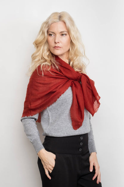Woman wearing sangria red cashmere wrap tied over grey sweater – Love Cashmere NZ