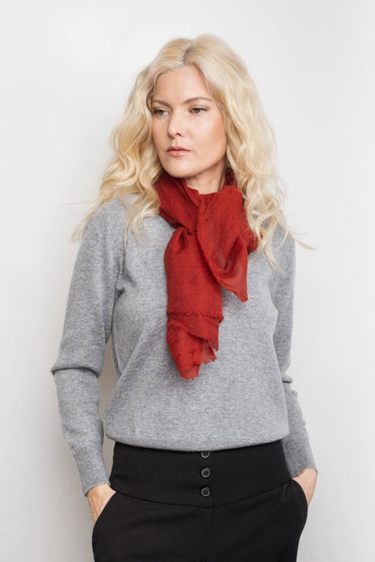 Model in grey wearing sangria red cashmere scarf at neck – Love Cashmere NZ