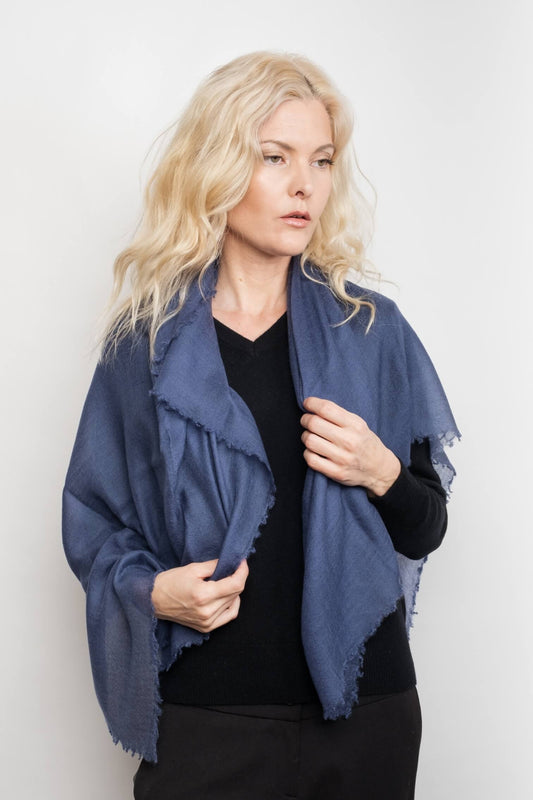 Model holding berry blue cashmere wrap over her shoulders – Love Cashmere NZ