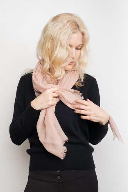 Model tying pale pink lightweight cashmere scarf – Love Cashmere NZ