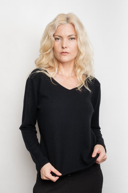 Woman wearing black relaxed V-neck cashmere sweater – Love Cashmere NZ