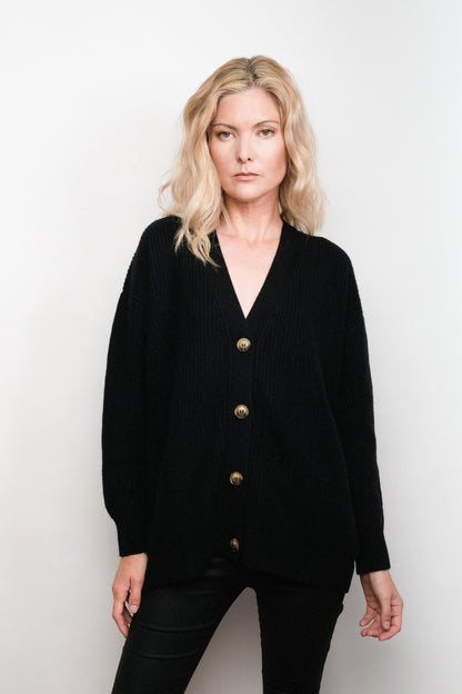 Model wearing black relaxed-fit cashmere cardigan, studio view – Love Cashmere NZ