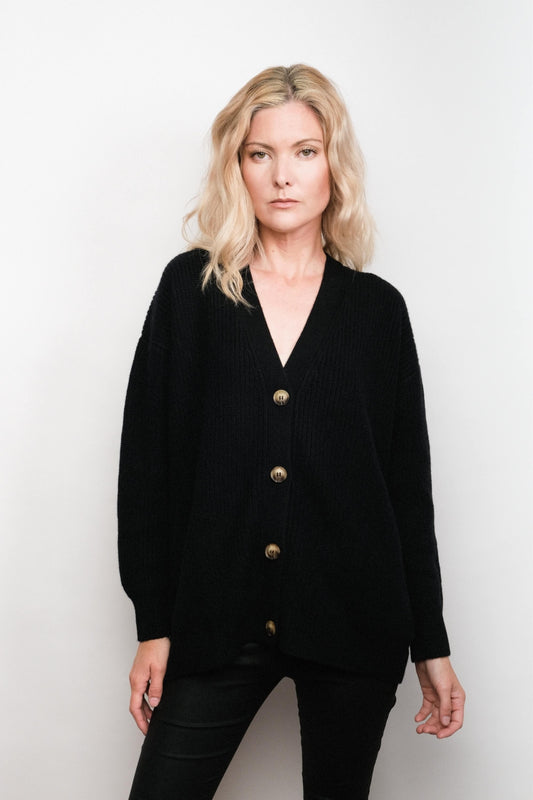 Model wearing black relaxed-fit cashmere cardigan, studio view – Love Cashmere NZ