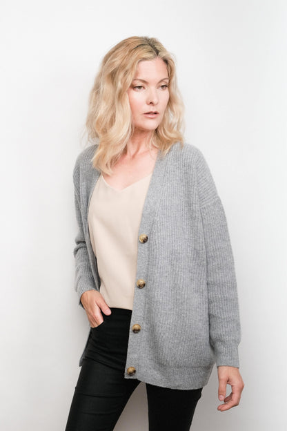 Model wearing grey cashmere cardigan over cream camisole – Love Cashmere NZ