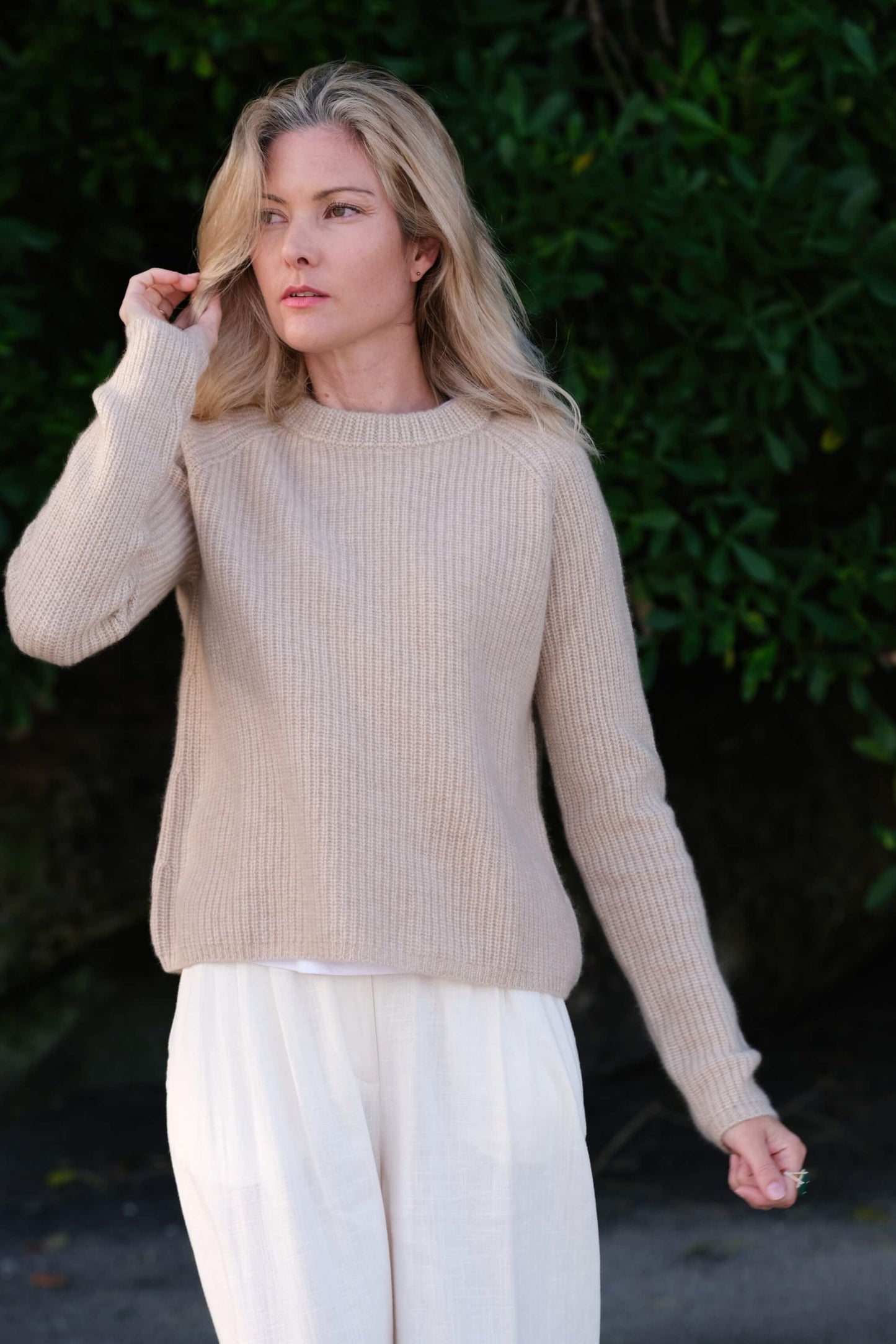 Woman outdoors in beige ribbed fisherman cashmere sweater – Love Cashmere NZ