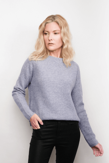 Model wearing grey fisherman cashmere sweater, studio view – Love Cashmere NZ