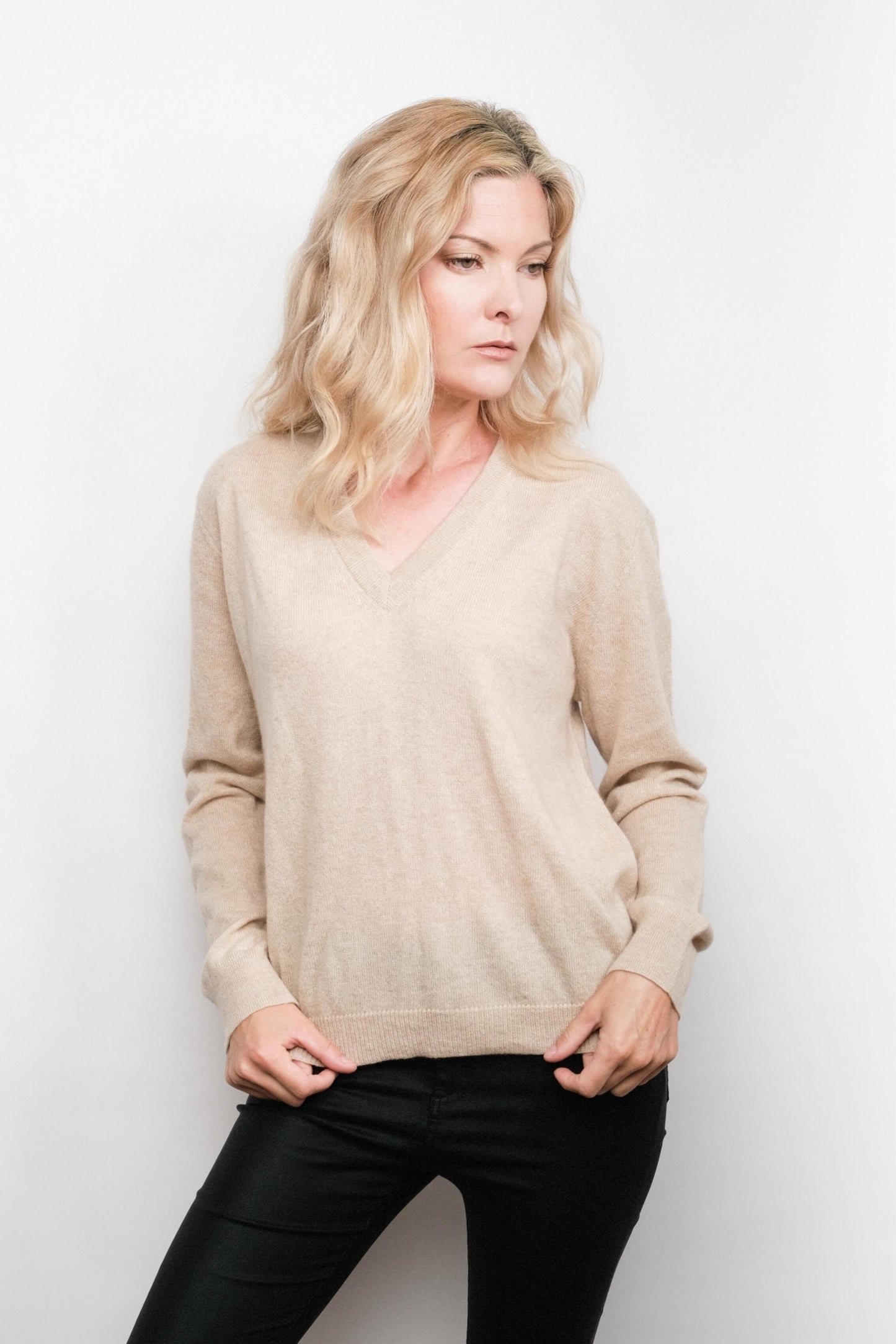 Model in beige cashmere V-neck sweater, front view – Love Cashmere NZ