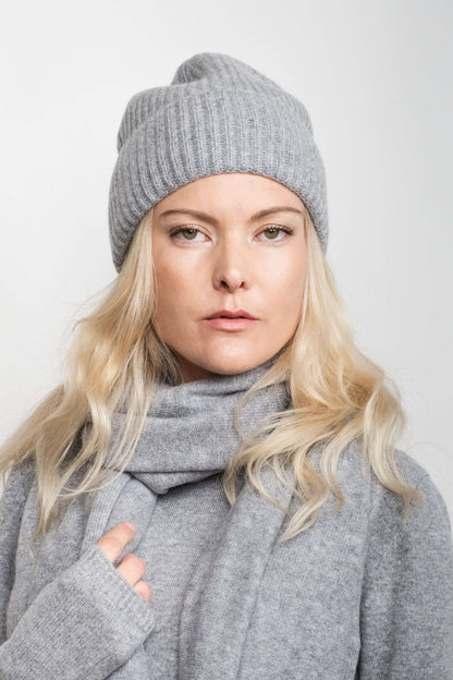 Woman wearing grey cashmere beanie and scarf, hands raised – Love Cashmere NZ
