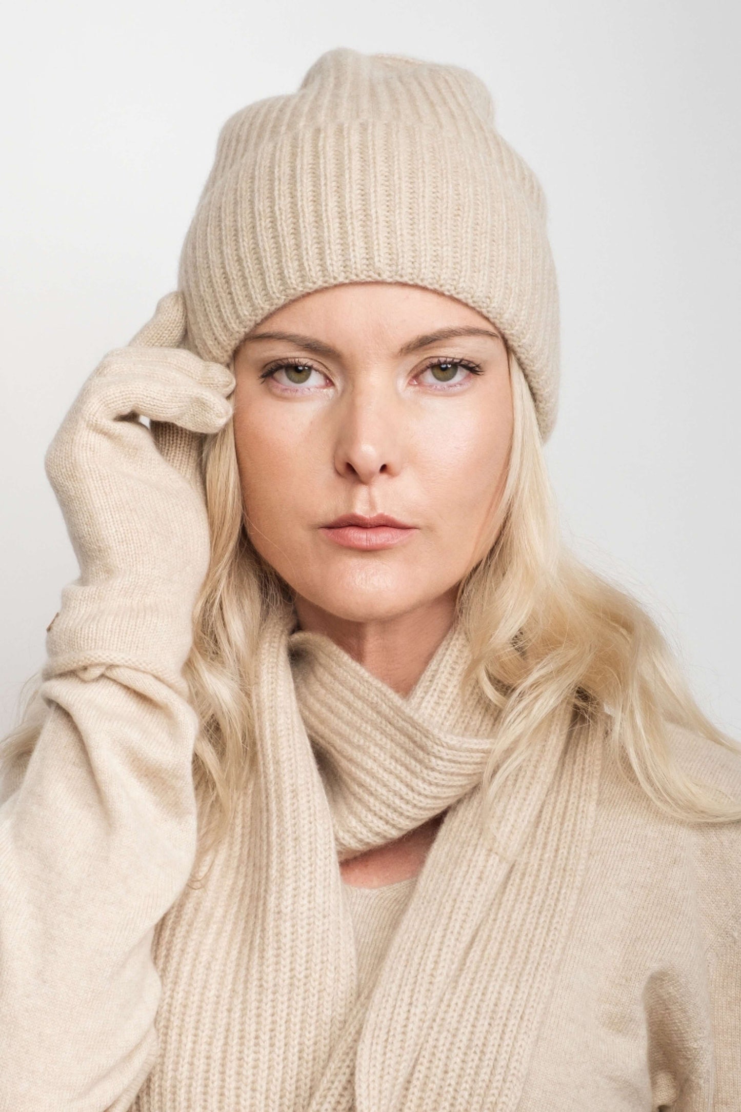 Woman wearing beige cashmere beanie with cream scarf and gloves – Love Cashmere NZ