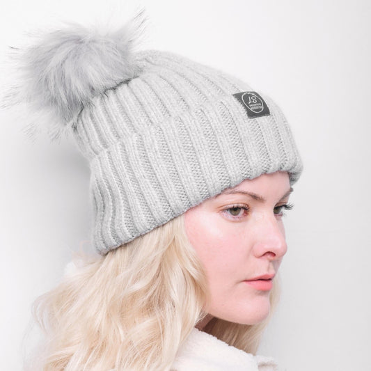 Side view of model wearing grey pom pom beanie – LS Silk NZ