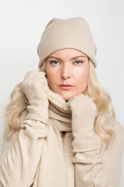 Woman in cream beanie and scarf wearing beige cashmere gloves – Love Cashmere NZ