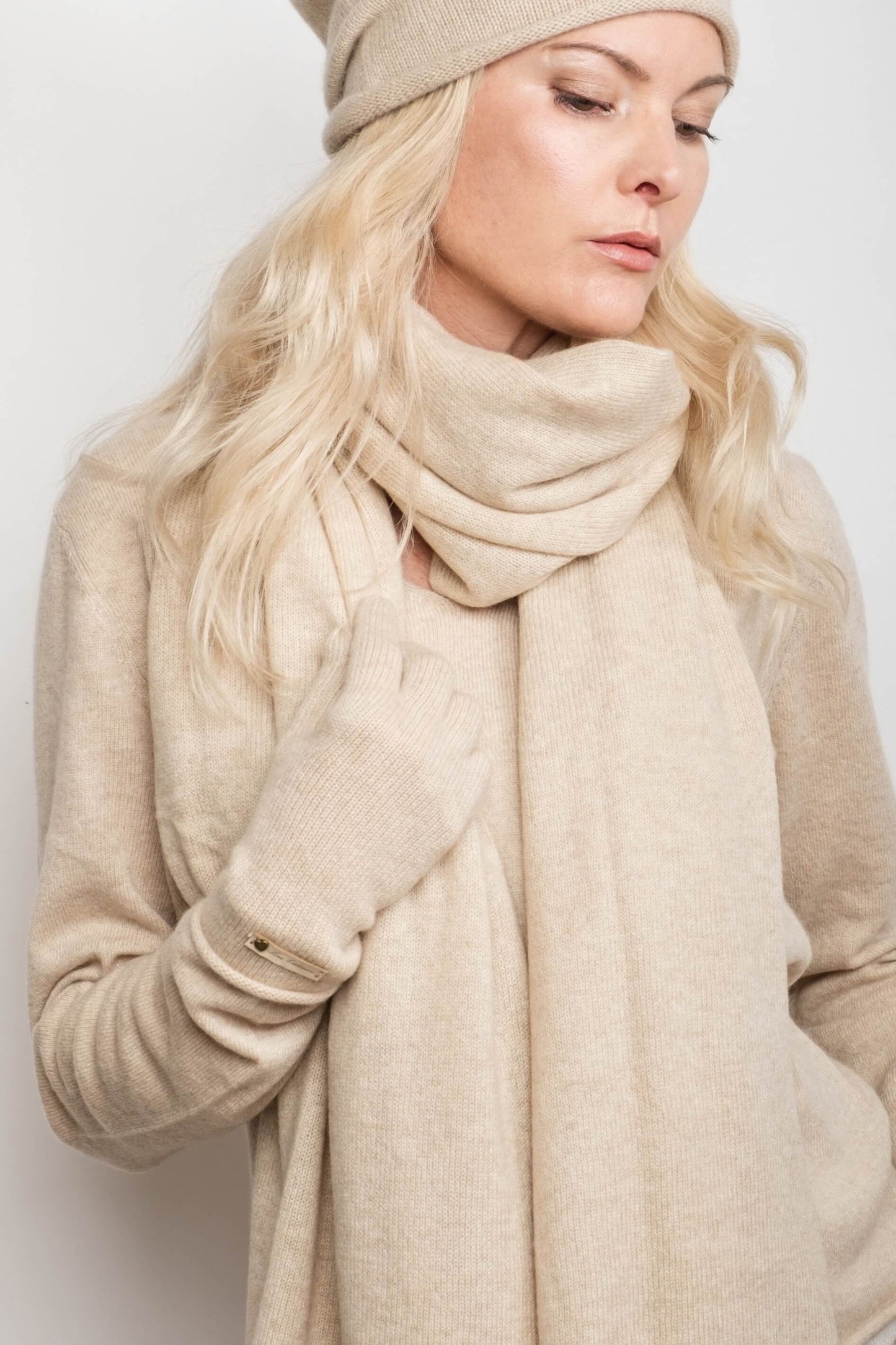 Model in cream knitwear wearing beige cashmere gloves – Love Cashmere NZ
