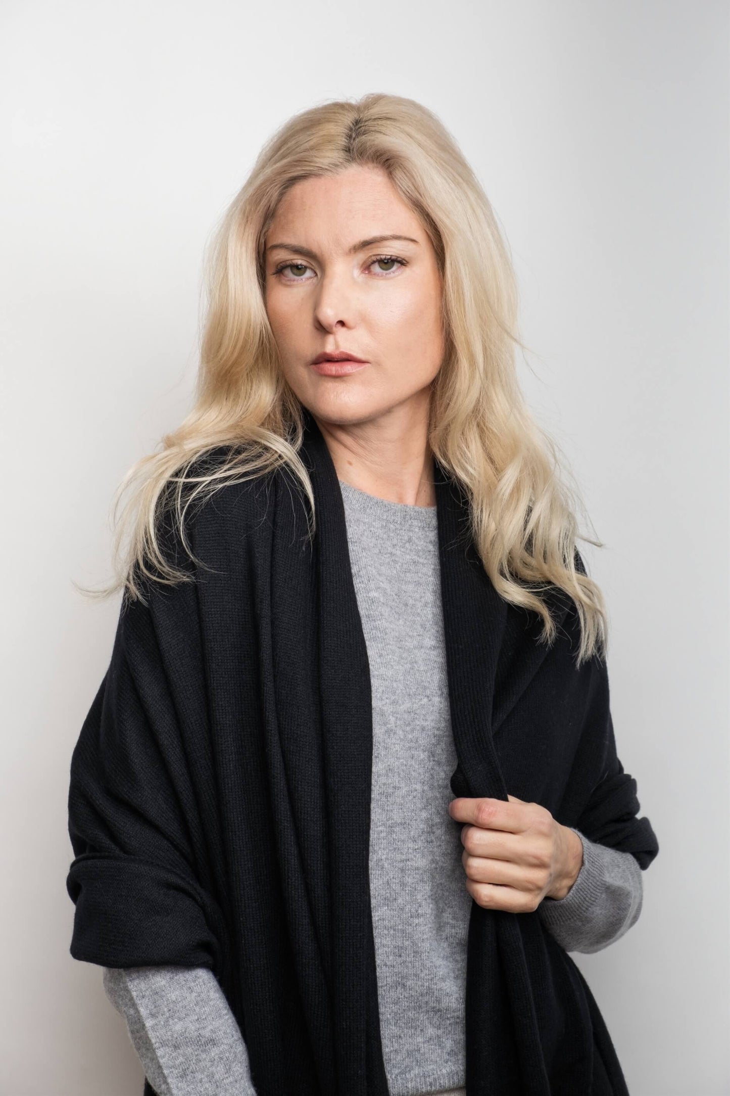 Woman wearing black cashmere wrap over grey sweater – Love Cashmere NZ