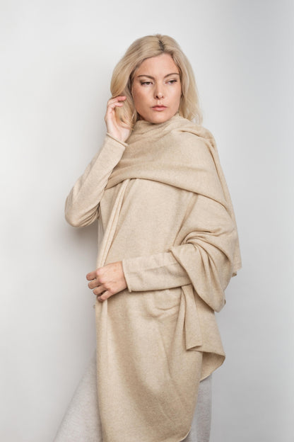 Model draped in oversized beige cashmere wrap poncho-style – Love Cashmere NZ