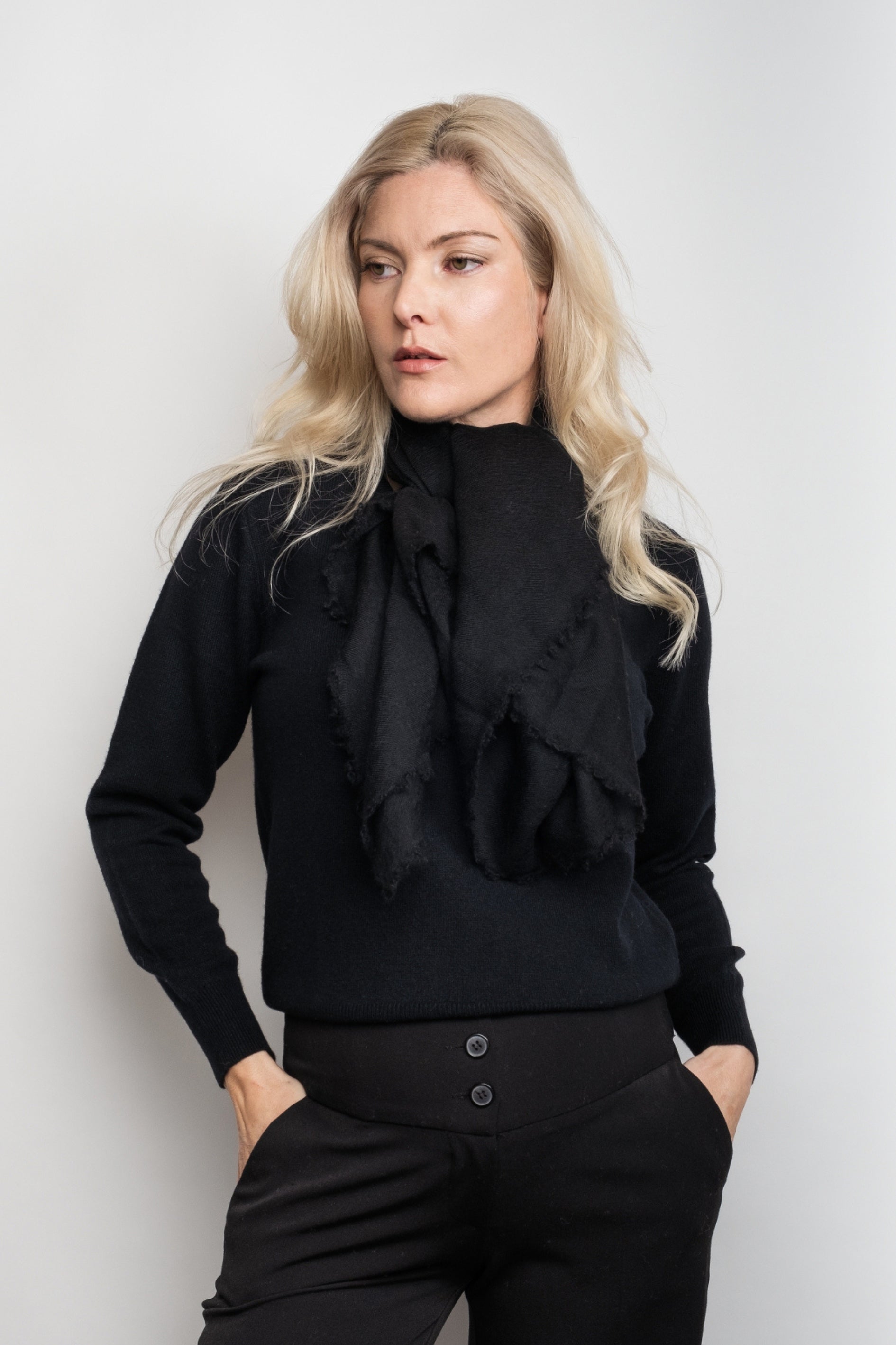Model in black wearing black ultrafine cashmere scarf at neck – Love Cashmere NZ
