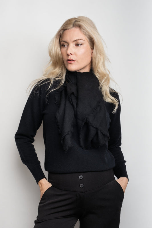 Model in black wearing black ultrafine cashmere scarf at neck – Love Cashmere NZ