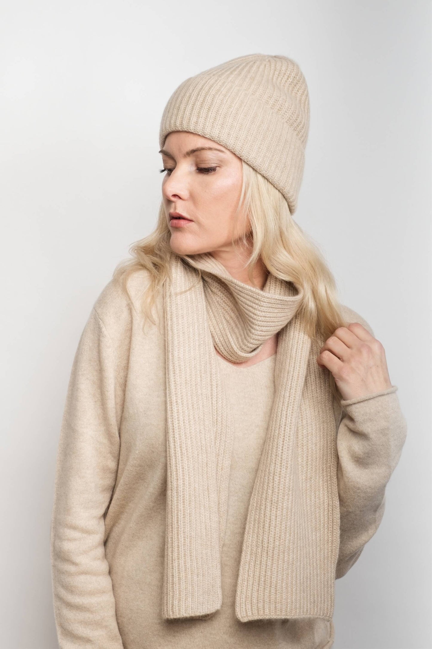 Woman in cream knitwear wearing slim cream cashmere scarf – Love Cashmere NZ