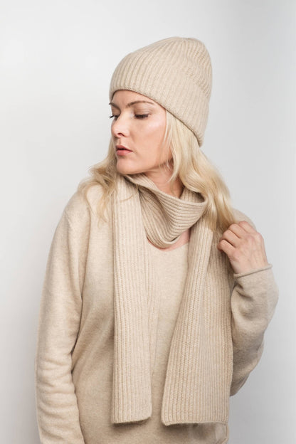 Woman in cream knitwear wearing slim cream cashmere scarf – Love Cashmere NZ