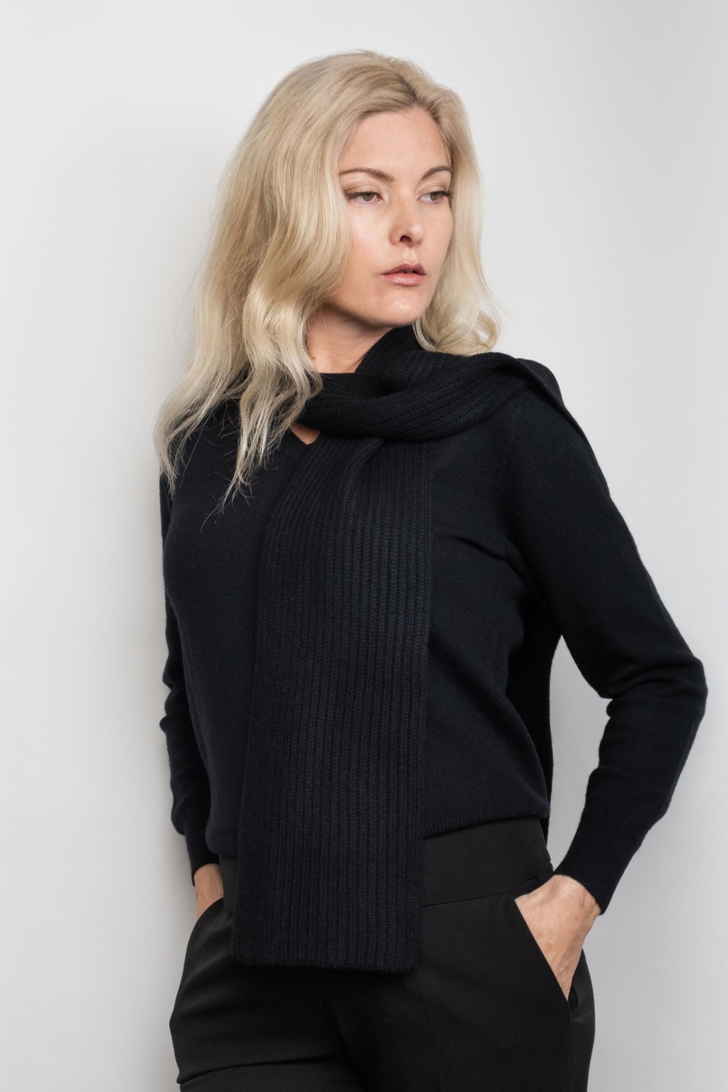 Woman in black outfit wearing slim black cashmere scarf – Love Cashmere NZ