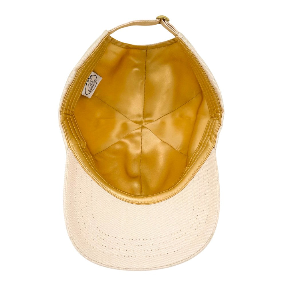 Beige baseball cap underside showing gold silk lining – LS Silk NZ