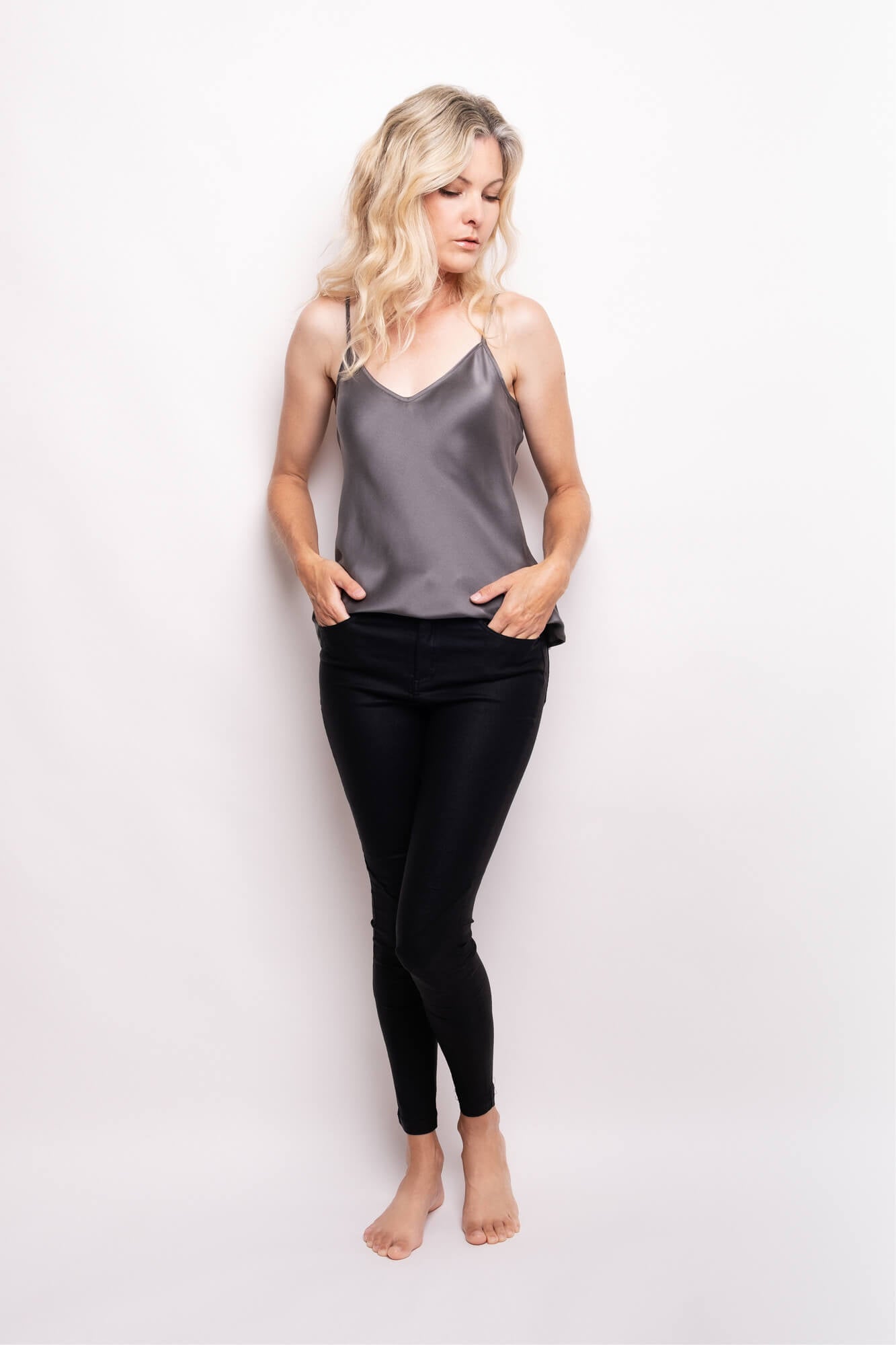 Model wearing shadow grey silk camisole with black leggings – LS Silk NZ