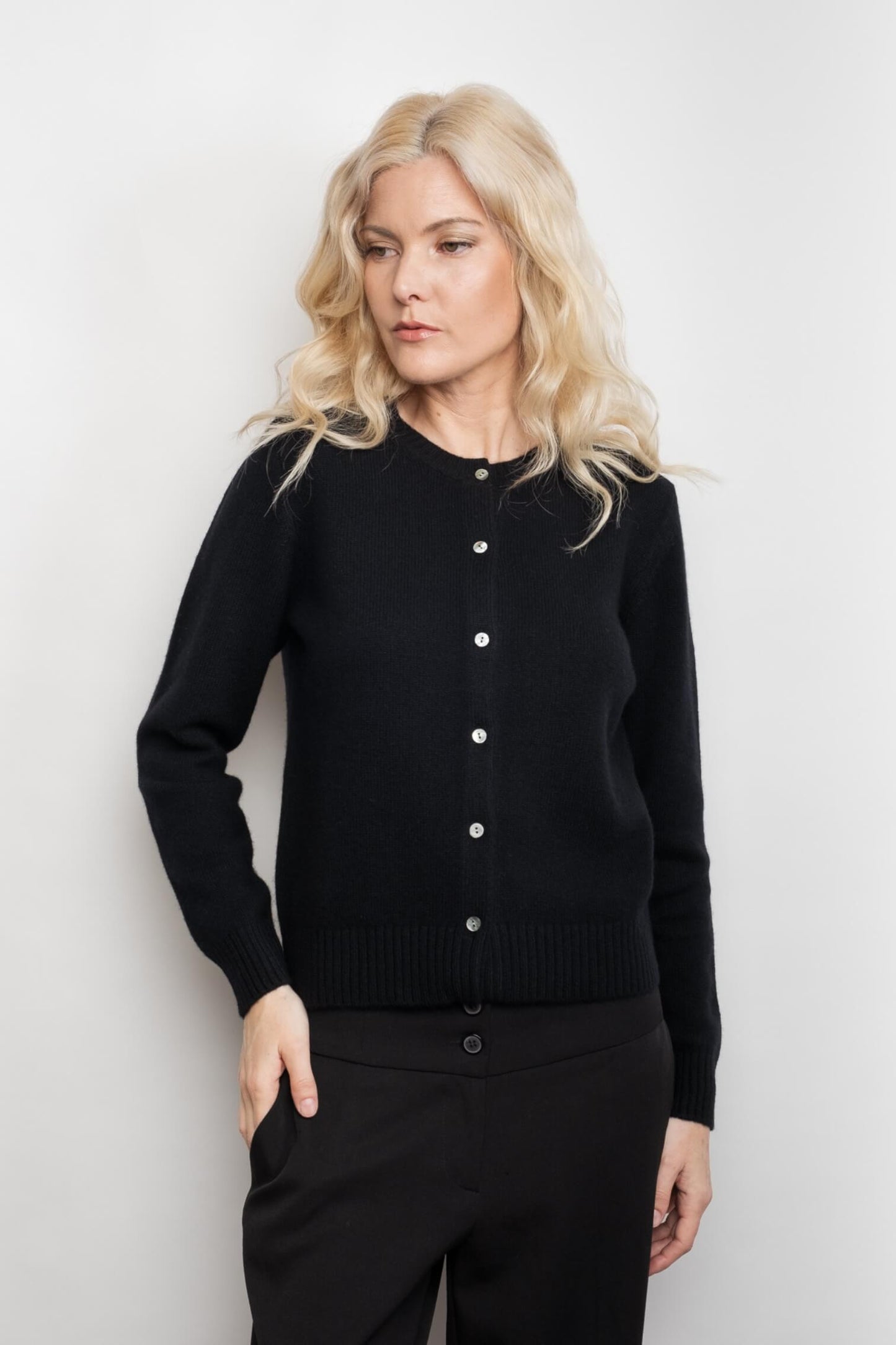 Woman in black cashmere cardigan, hand in pocket – Love Cashmere NZ