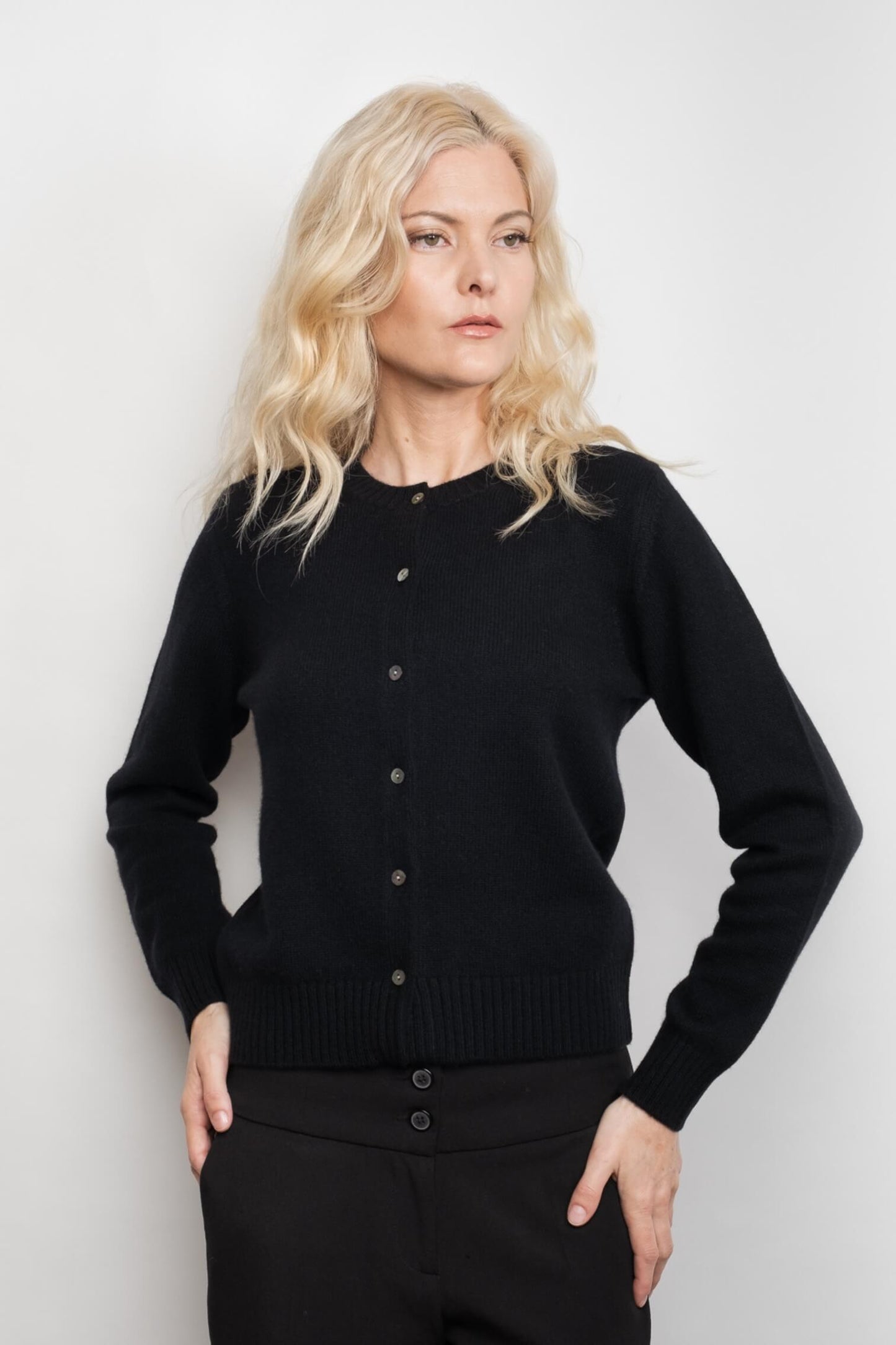 Model wearing black button-front cashmere golfer cardigan – Love Cashmere NZ