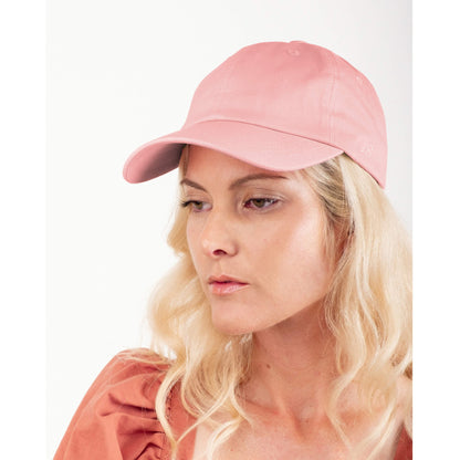 Front view of model wearing pink silk-lined baseball cap – LS Silk NZ