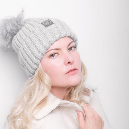 Model wearing grey silk-lined pom pom beanie – LS Silk NZ
