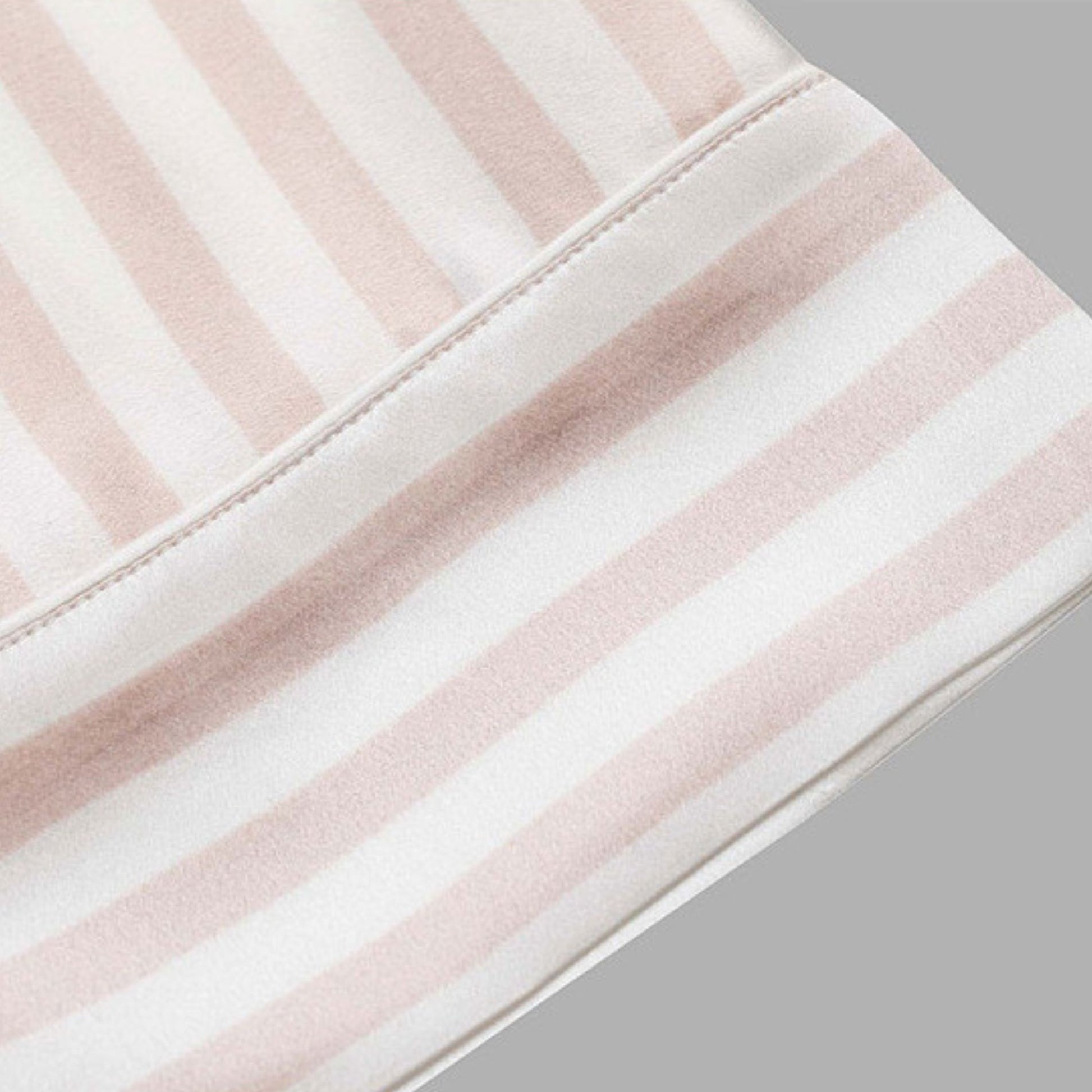 Close-up of pink and white striped silk fabric hem – LS Silk NZ
