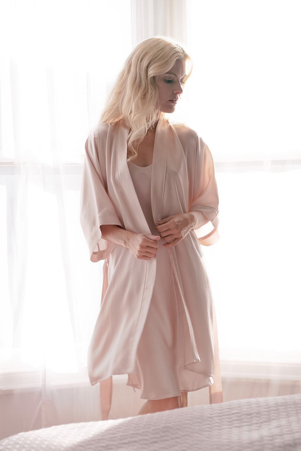 Woman in pink silk kimono robe backlit by window – LS Silk NZ