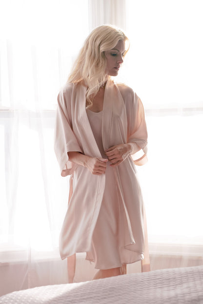 Woman in pink silk kimono robe backlit by window – LS Silk NZ